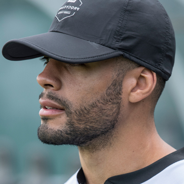 Male wearing personalised black cap